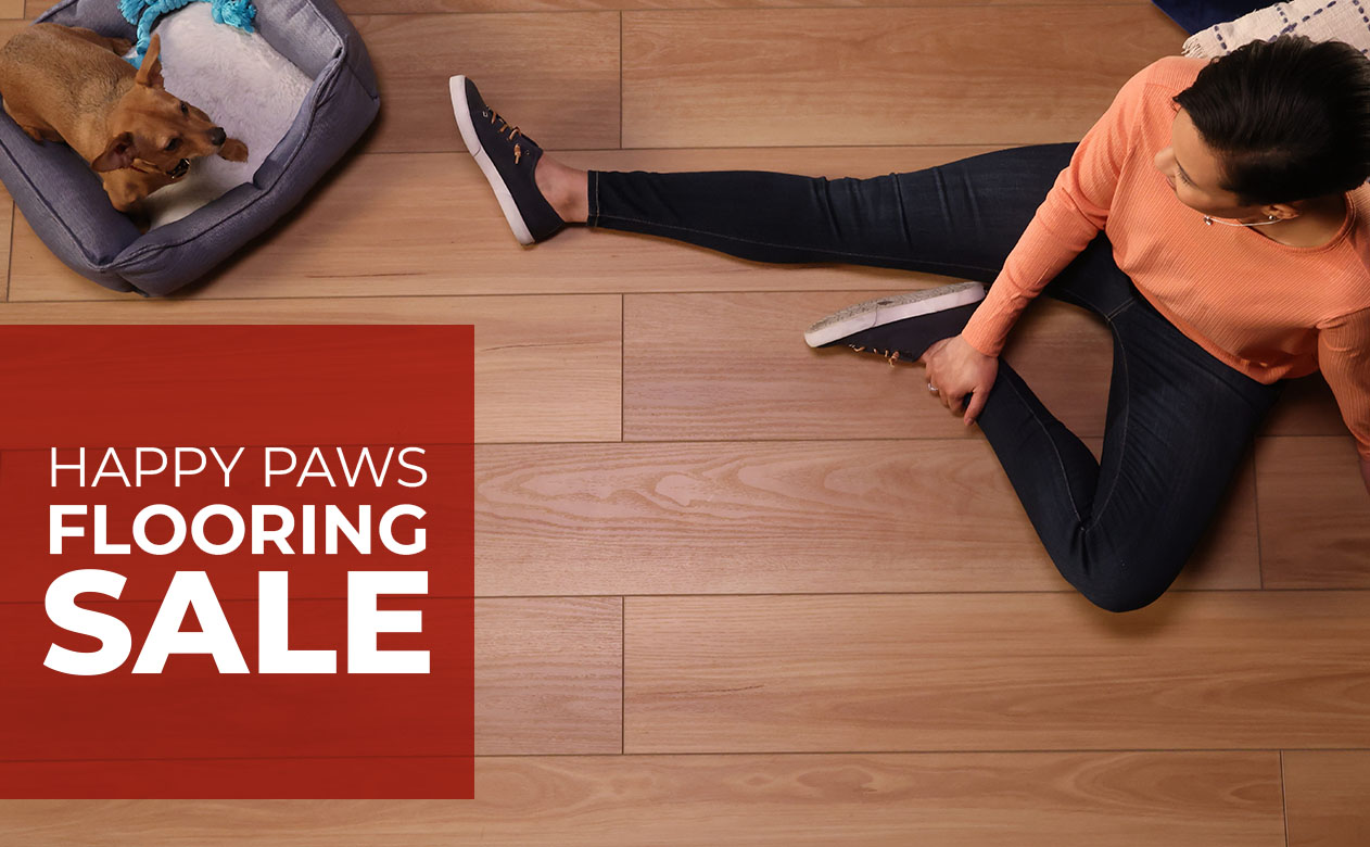 Woman listening to music on carpet with spilled coffee next to her